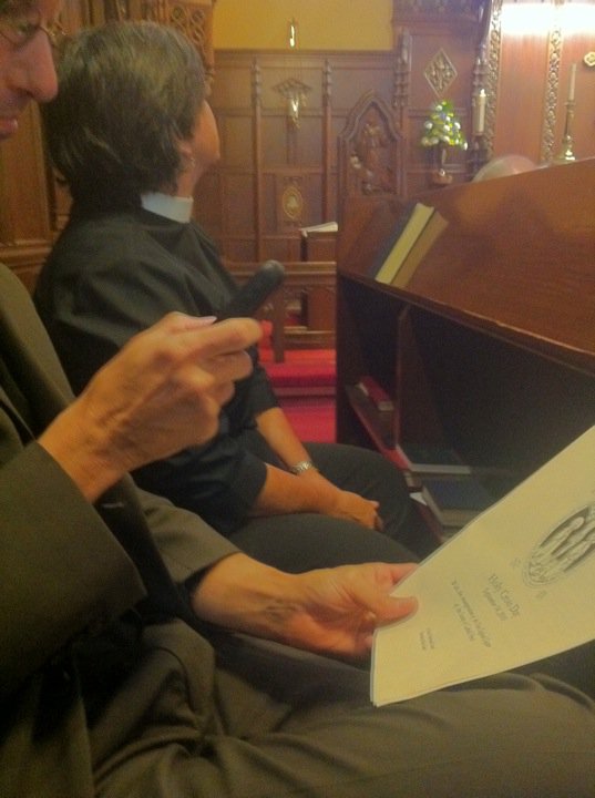 Tim Schenck using a cell phone in church